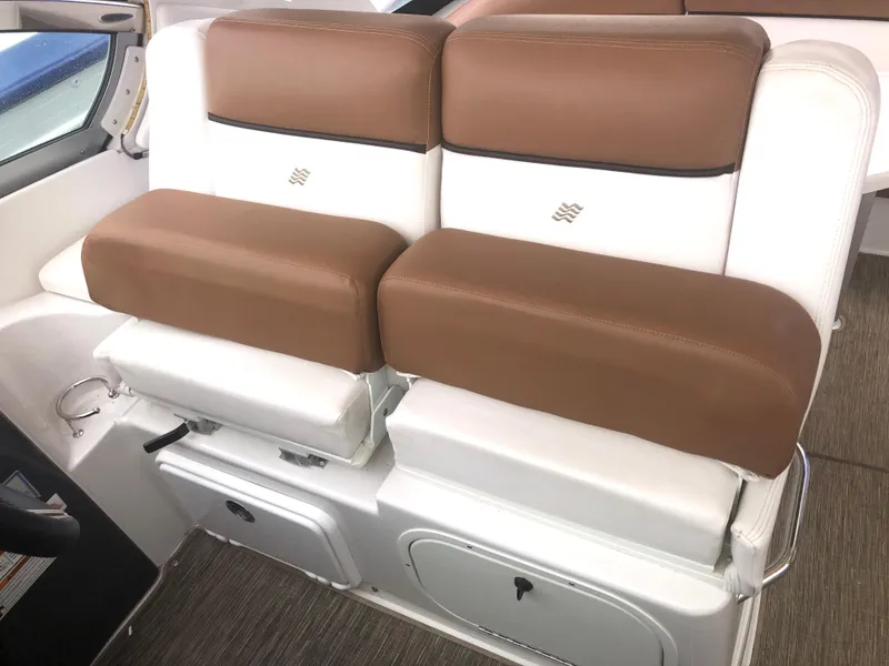 Slide: The Image of 2018 Four Winns V355 boat seating with brown and white upholstery. - 8