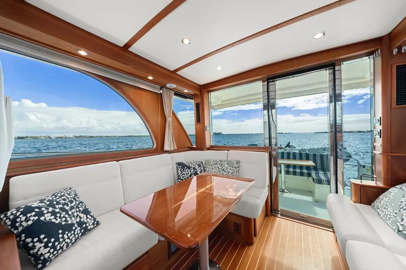 Slide: The Image of Interior of 2019 Sabre 45 Salon Express yacht with ocean view through large windows. - 11