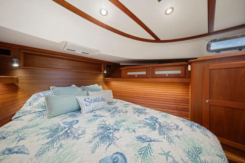 Slide: The Image of Luxurious bathroom in 2019 Sabre 45 Salon Express yacht with wood cabinetry and modern fixtures. - 28