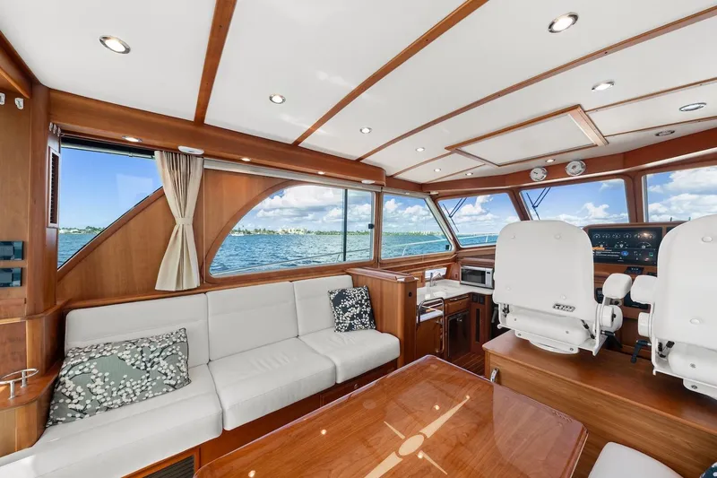 Slide: The Image of Luxurious interior of 2019 Sabre 45 Salon Express yacht with panoramic windows and elegant seating. - 6