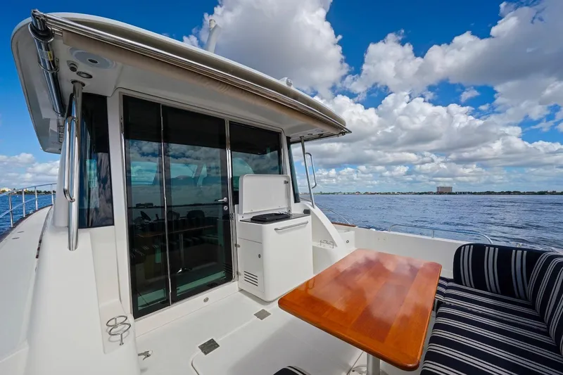 Slide: The Image of 2019 Sabre 45 Salon Express yacht on open water under blue sky. - 67