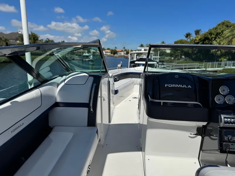Slide: The Image of 2023 Formula 350 Crossover Bowrider on a sunny day, showcasing sleek interior design. - 23