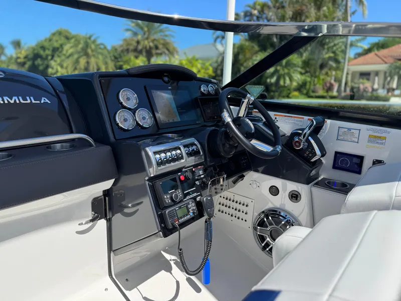 Slide: The Image of 2023 Formula 350 Crossover Bowrider cockpit with modern controls and sleek design. - 25
