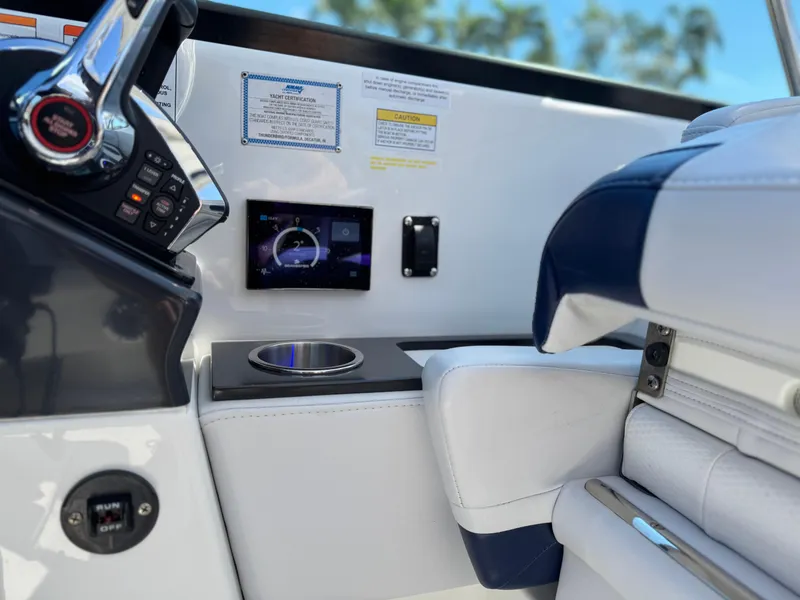 Slide: The Image of 2023 Formula 350 Crossover Bowrider cockpit with modern controls and luxurious seating. - 26