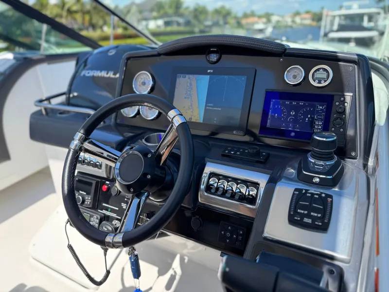 Slide: The Image of 2023 Formula 350 Crossover Bowrider dashboard with advanced navigation and control systems. - 28