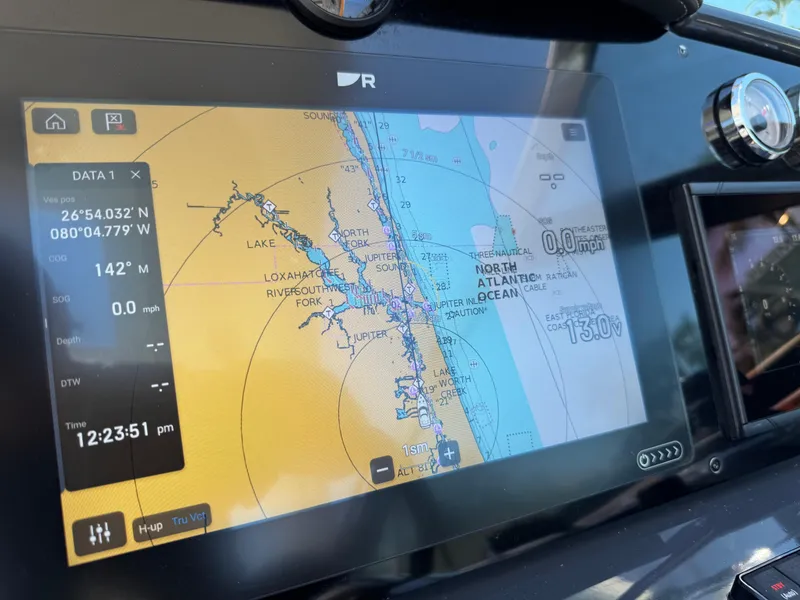 Slide: The Image of Navigation display on 2023 Formula 350 Crossover Bowrider, showing coastal map and coordinates. - 30