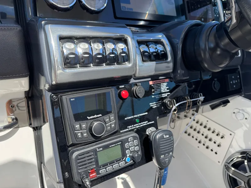 Slide: The Image of Control panel of 2023 Formula 350 Crossover Bowrider with navigation and communication equipment. - 31
