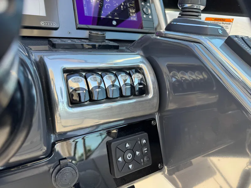 Slide: The Image of 2023 Formula 350 Crossover Bowrider dashboard with control panel and navigation system. - 32