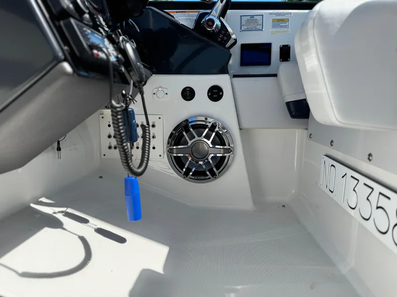 Slide: The Image of 2023 Formula 350 Crossover Bowrider cockpit with modern controls and speaker system. - 33
