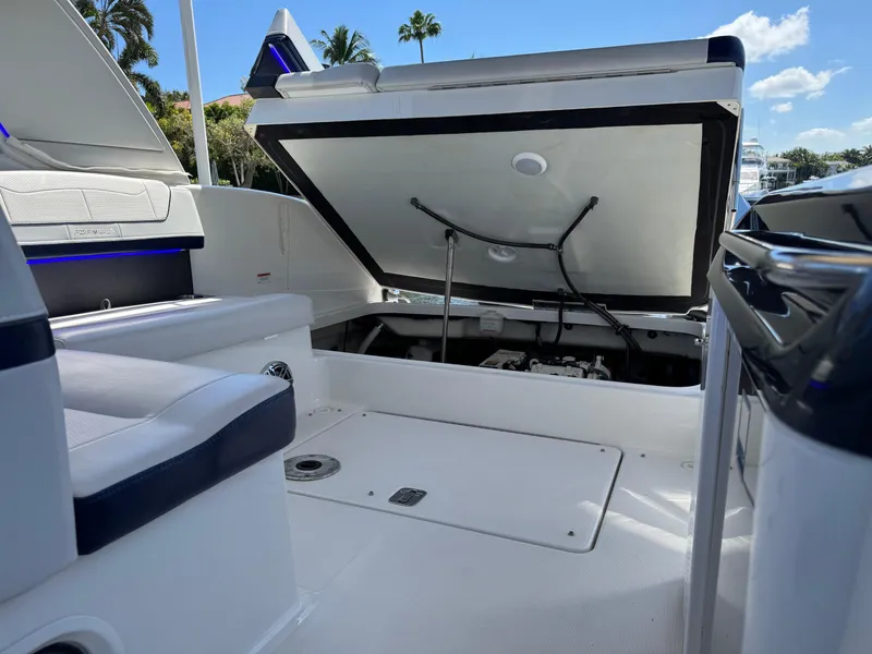 Slide: The Image of 2023 Formula 350 Crossover Bowrider with open storage compartment, showcasing sleek interior design. - 44