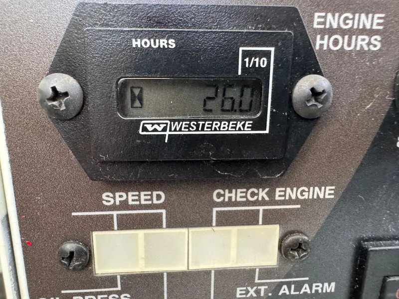 Slide: The Image of Digital engine hour meter reading 26.0 on a Westerbeke panel, Formula 350 Crossover Bowrider 2023. - 47