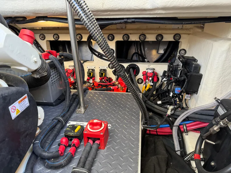 Slide: The Image of Engine compartment of 2023 Formula 350 Crossover Bowrider with wiring and components. - 48