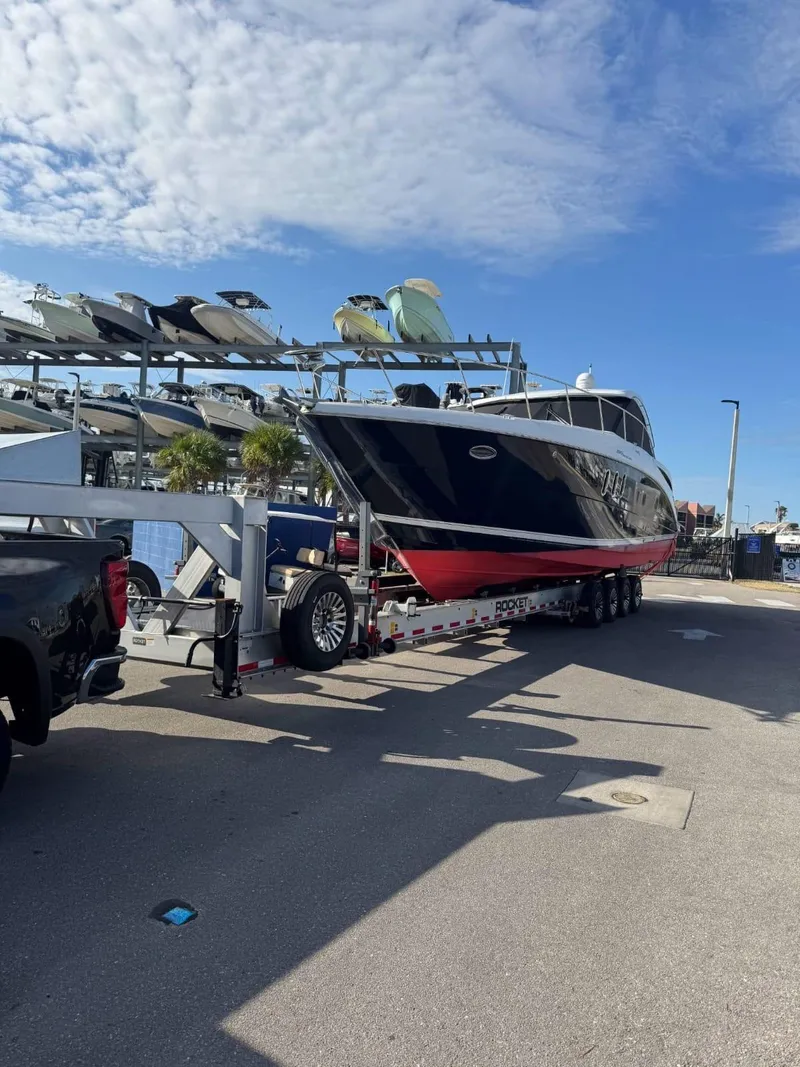 Slide: The Image of 2008 Cruisers Yachts 390 Sports Coupe on trailer under blue sky. - 12