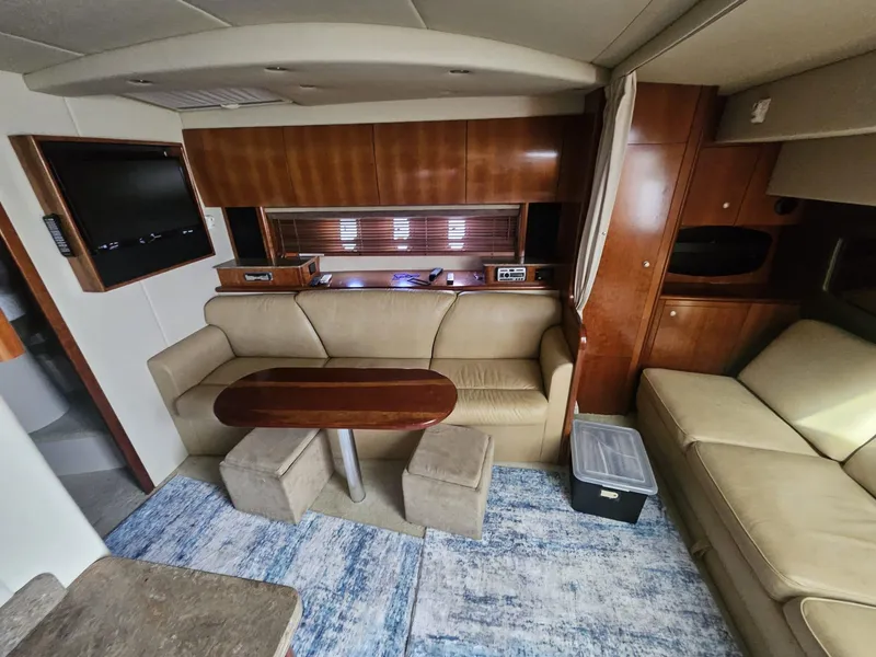 Slide: The Image of Interior of 2008 Cruisers Yachts 390 Sports Coupe with leather seating and wooden accents. - 5