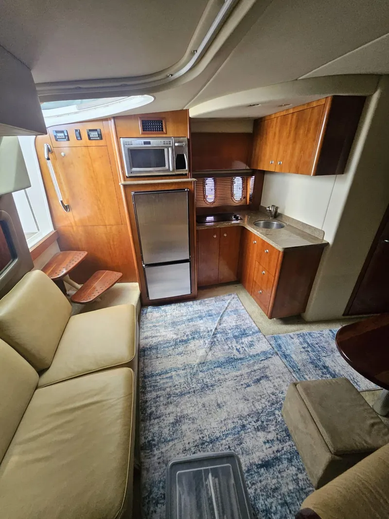 Slide: The Image of Interior of 2008 Cruisers Yachts 390 Sports Coupe with kitchen and seating area. - 6