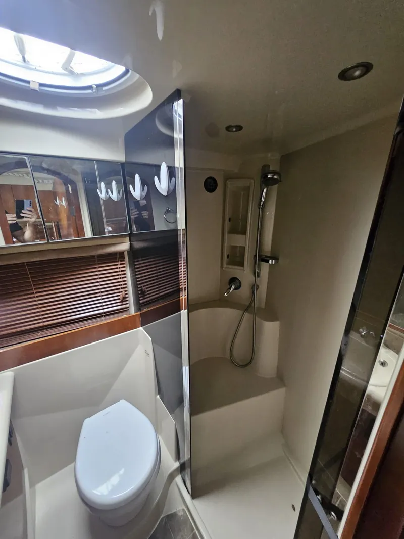 Slide: The Image of 2008 Cruisers Yachts 390 Sports Coupe bathroom with shower and toilet. - 7