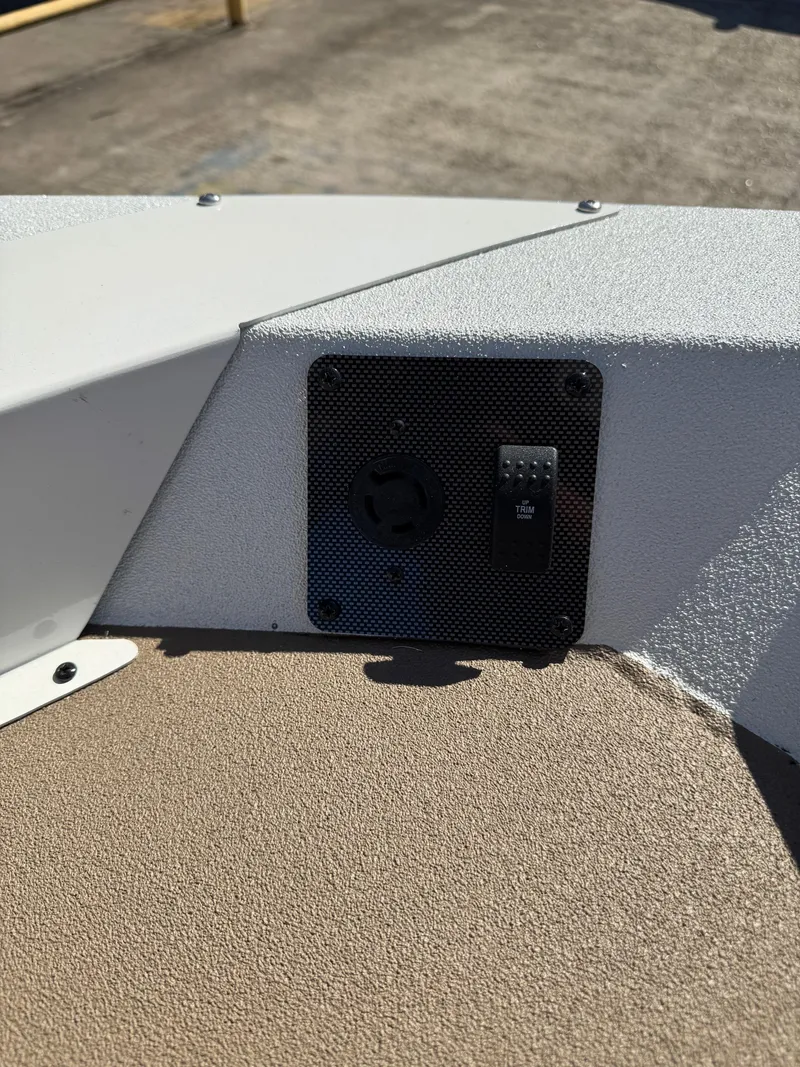 Slide: The Image of 2025 SeaArk Bay Runner 190 boat dashboard detail with switch panel. - 6