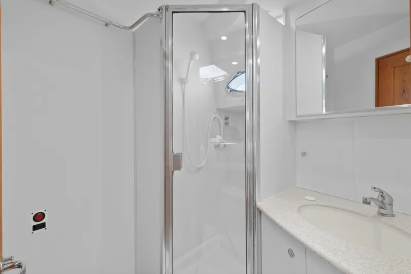 Slide: The Image of Bathroom interior of 2000 Silverton 392 Motor Yacht with shower and sink. - 24