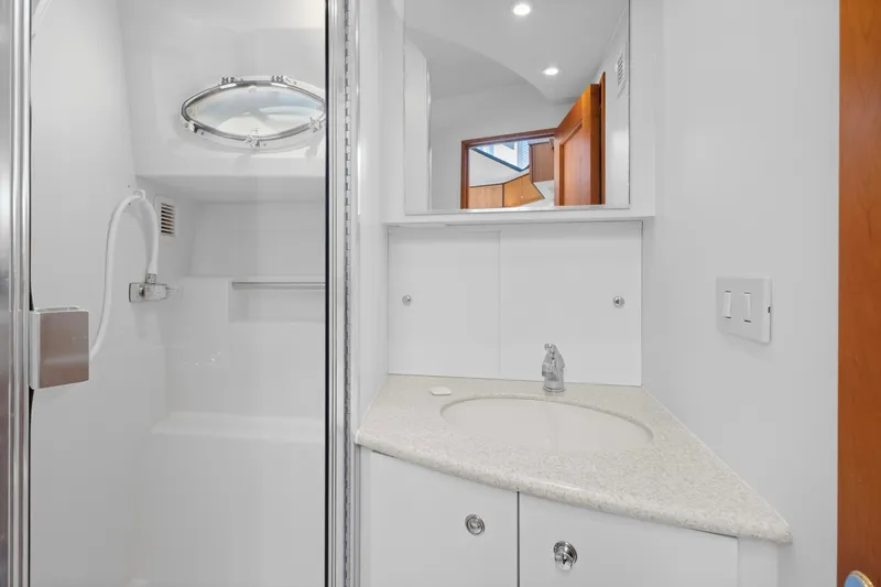 Slide: The Image of Bathroom interior of 2000 Silverton 392 Motor Yacht with shower and sink. - 25