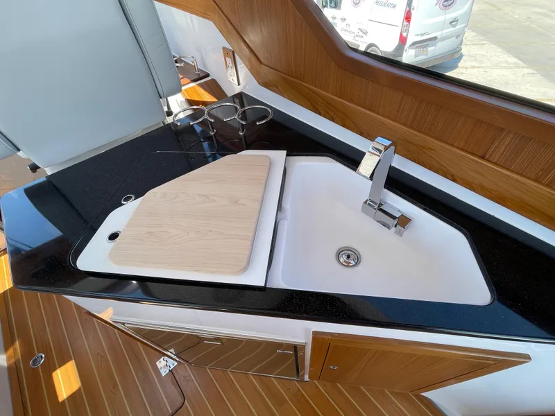 Slide: The Image of Modern kitchen area in 2025 True North 34 Outboard Express yacht. - 30