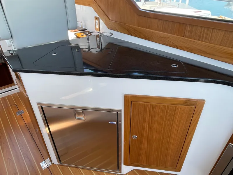 Slide: The Image of Luxurious interior of 2025 True North 34 Outboard Express yacht with sleek countertop. - 32