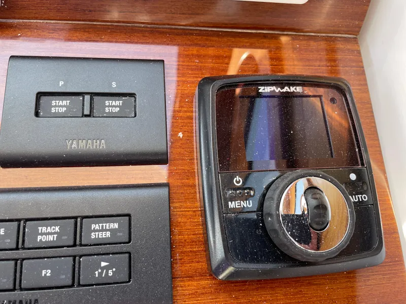Slide: The Image of Control panel of 2025 True North 34 Outboard Express with Yamaha and Zipwake systems. - 38