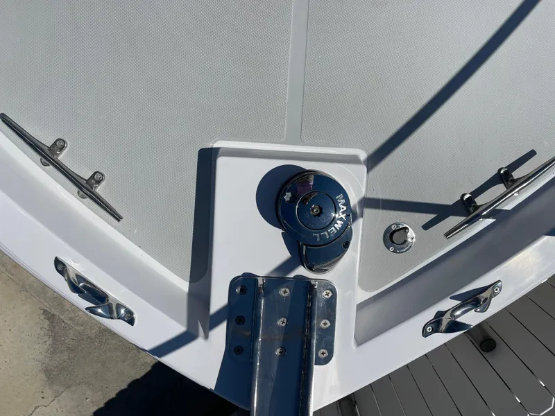 Slide: The Image of Bow of 2025 True North 34 Outboard Express with anchor winch and cleats. - 9