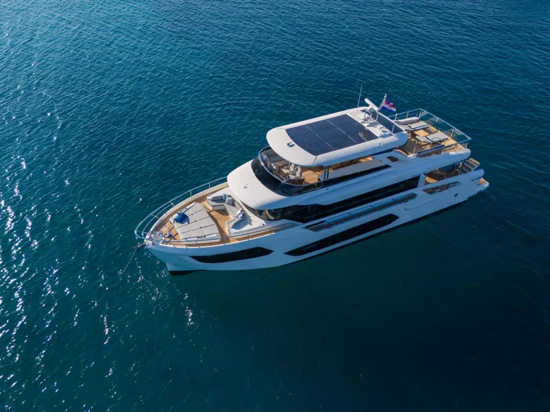 Slide: The Image of 2024 Absolute NAVETTA 75 yacht cruising on open blue waters. - 7