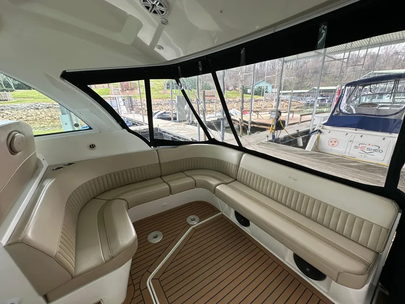 Slide: The Image of 2009 Cruisers Yachts 420 Sports Coupe interior with beige seating and wood flooring. - 22