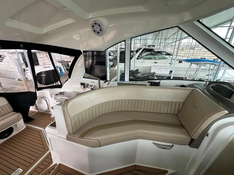 Slide: The Image of 2009 Cruisers Yachts 420 Sports Coupe interior with beige seating and wood flooring. - 23