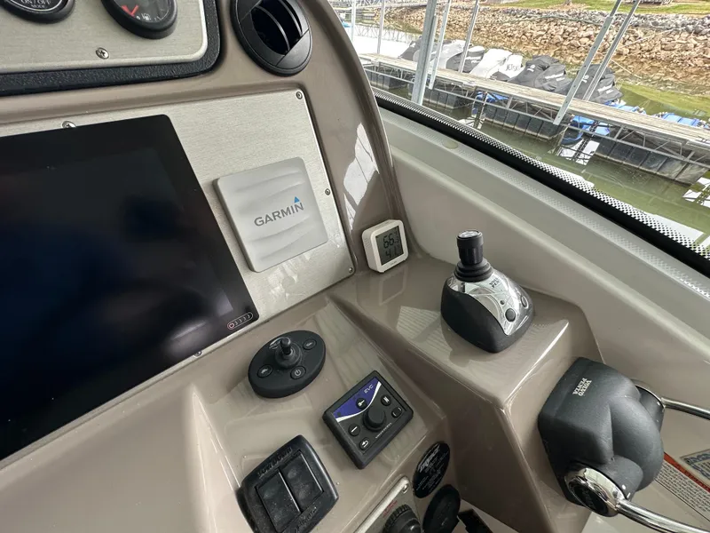 Slide: The Image of Control panel of 2009 Cruisers Yachts 420 Sports Coupe with Garmin navigation system. - 24