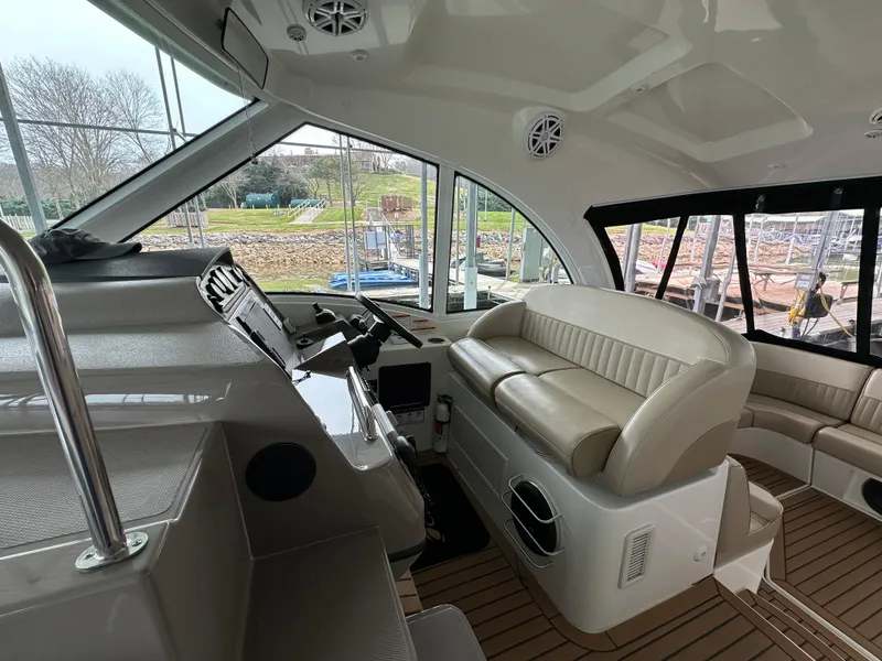 Slide: The Image of 2009 Cruisers Yachts 420 Sports Coupe interior with helm and seating area. - 27