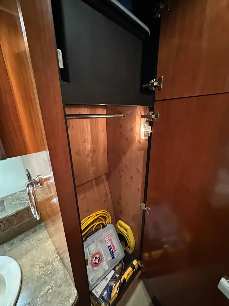 Slide: The Image of 2009 Cruisers Yachts 420 Sports Coupe interior closet with storage items. - 30