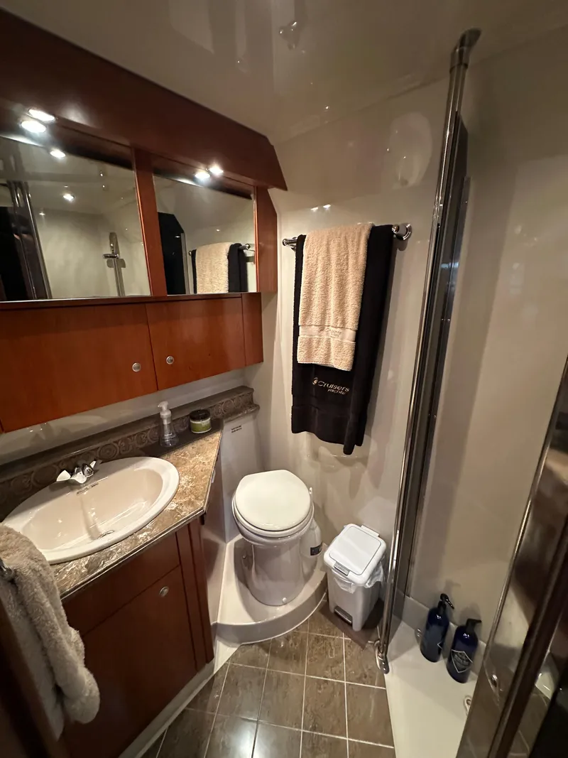 Slide: The Image of 2009 Cruisers Yachts 420 Sports Coupe bathroom with sink, toilet, and shower. - 36