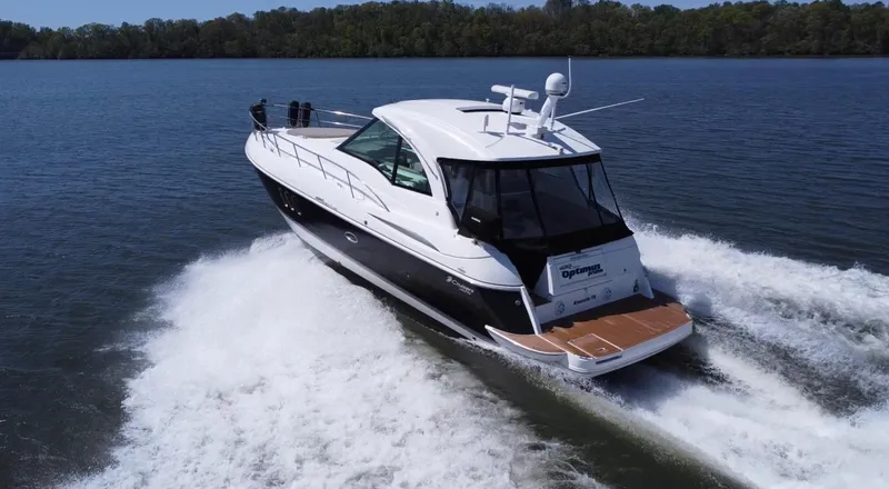 Slide: The Image of 2009 Cruisers Yachts 420 Sports Coupe cruising on a serene lake. - 5