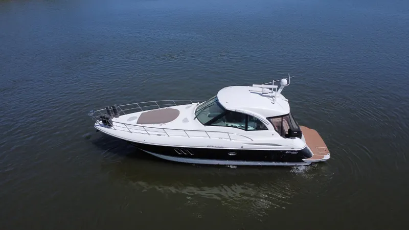 Slide: The Image of 2009 Cruisers Yachts 420 Sports Coupe on calm water, aerial view. - 6
