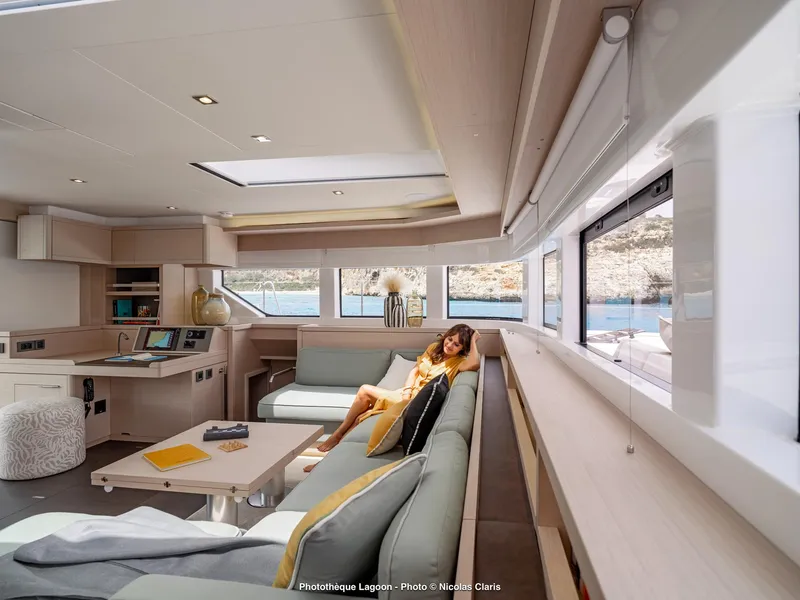 Slide: The Image of Luxurious interior of 2025 Lagoon 55 yacht with modern furnishings and scenic views. - 14