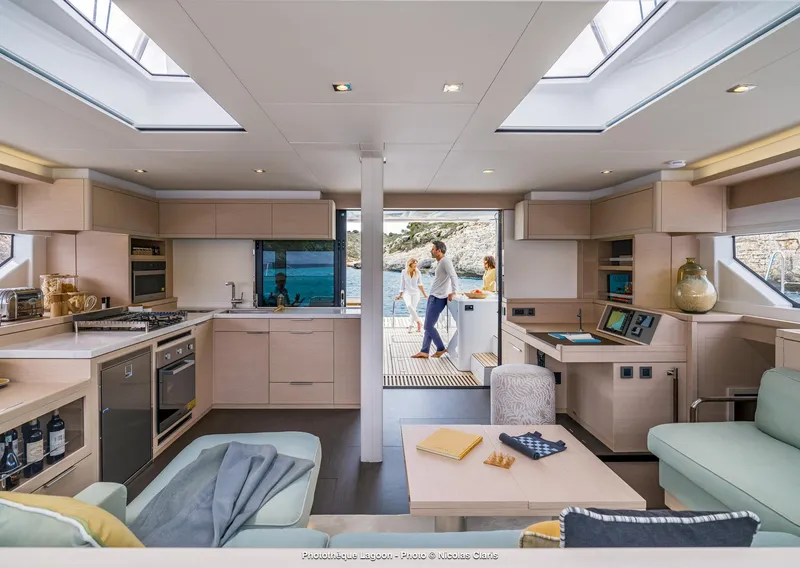 Slide: The Image of Luxurious interior of 2025 Lagoon 55 yacht with modern kitchen and lounge area. - 16