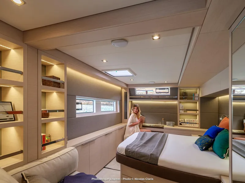 Slide: The Image of Luxurious interior of 2025 Lagoon 55 yacht with modern design and cozy bedroom. - 19