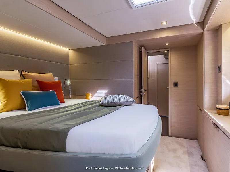 Slide: The Image of Luxurious interior of 2025 Lagoon 55 yacht with modern bedroom design. - 23