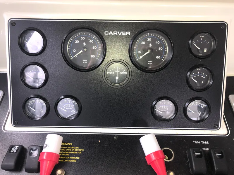 Slide: The Image of Instrument panel of a 1993 Carver 350 Aft Cabin boat with gauges and controls. - 17