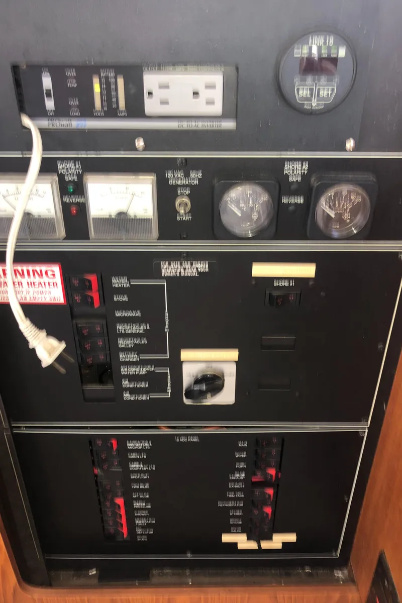 Slide: The Image of Electrical panel of 1993 Carver 350 Aft Cabin boat with gauges and switches. - 18