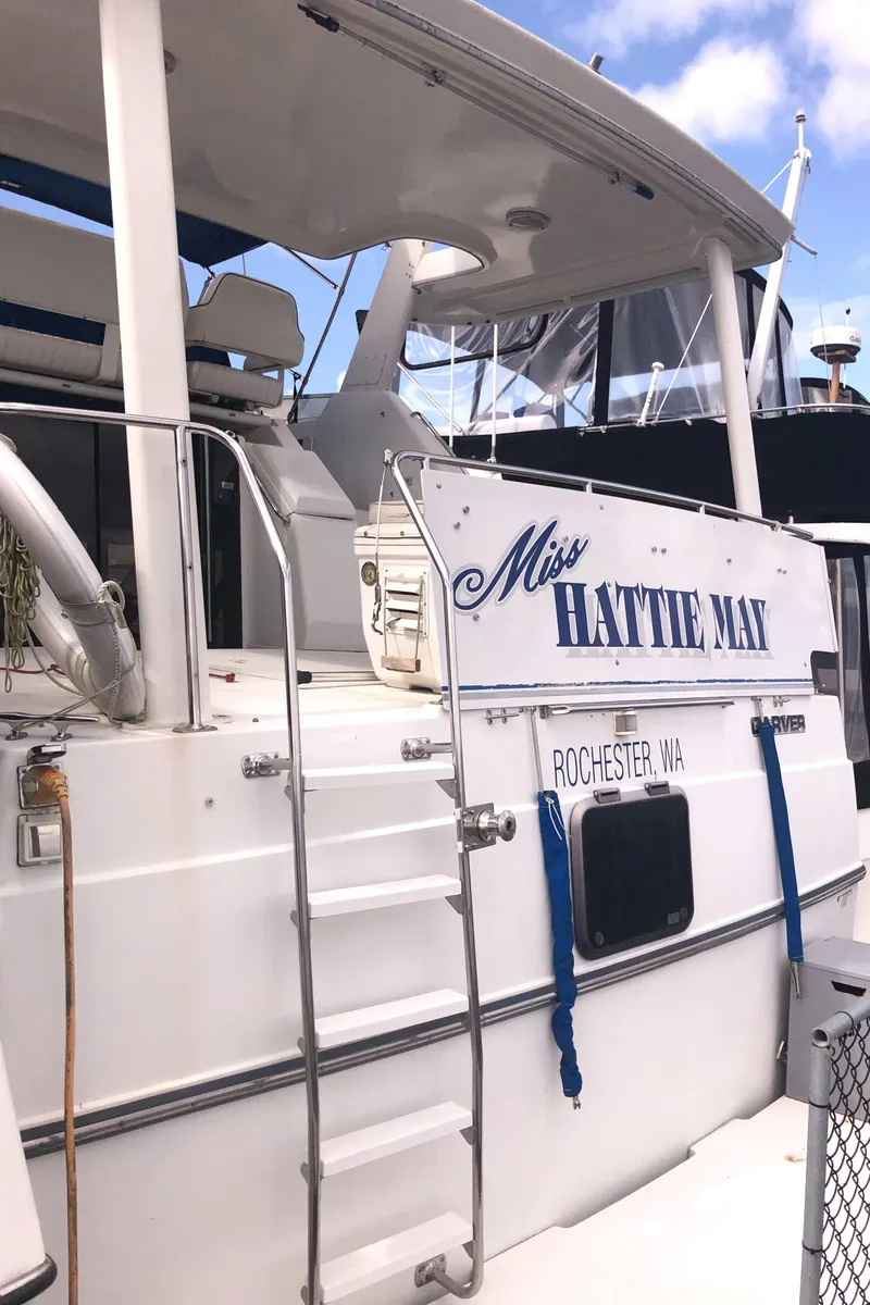 Slide: The Image of 1993 Carver 350 Aft Cabin yacht docked, featuring "Miss Hattie Mai" name and Rochester, MN registration. - 3
