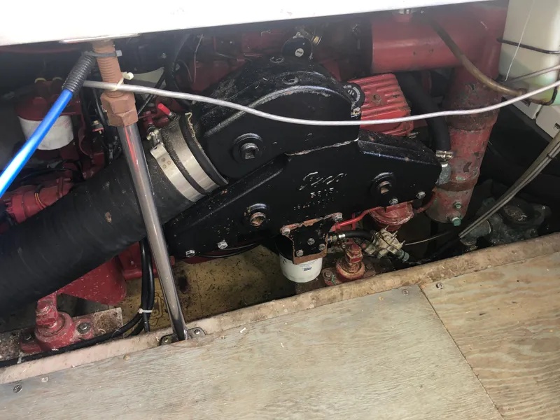 Slide: The Image of Engine compartment of a 1993 Carver 350 Aft Cabin boat, showing mechanical components. - 37