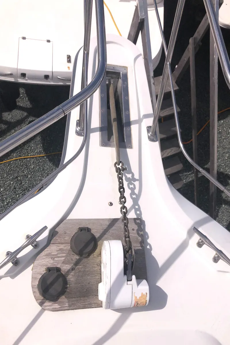 Slide: The Image of 1993 Carver 350 Aft Cabin boat deck with anchor chain and railing. - 44