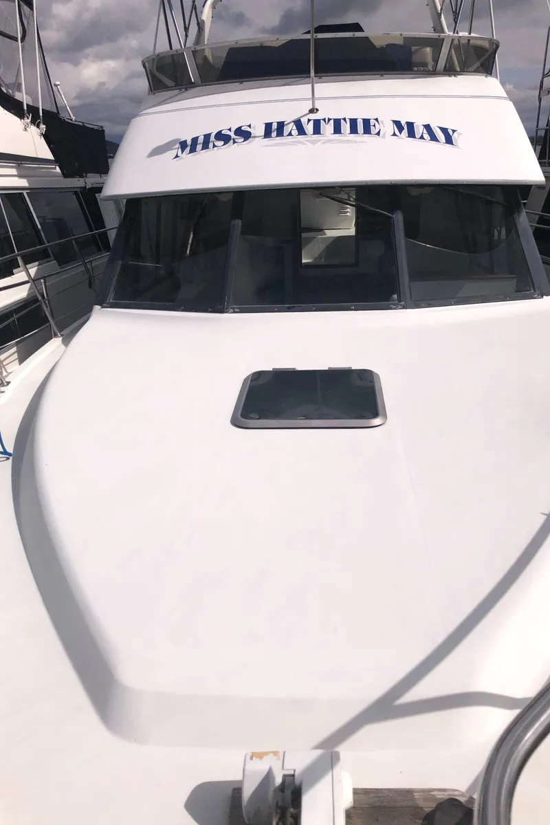 Slide: The Image of 1993 Carver 350 Aft Cabin yacht "Miss Hattie May" with sleek white exterior. - 45