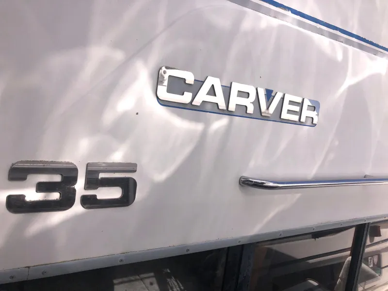 Slide: The Image of 1993 Carver 350 Aft Cabin boat exterior with model name and number. - 7