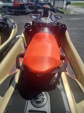Slide: The Image of 2025 Sea-Doo Waverunner RXT-X with vibrant orange seat, parked outdoors. - 5