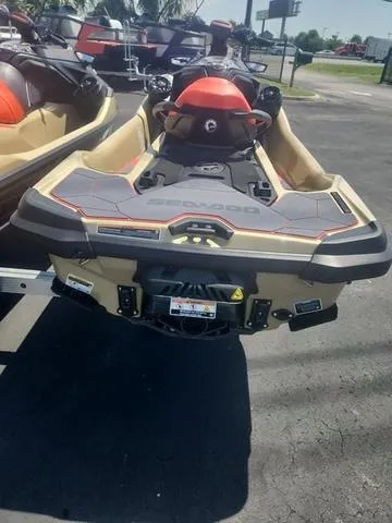 Slide: The Image of 2025 Sea-Doo Waverunner RXT-X, rear view, parked outdoors on pavement. - 7