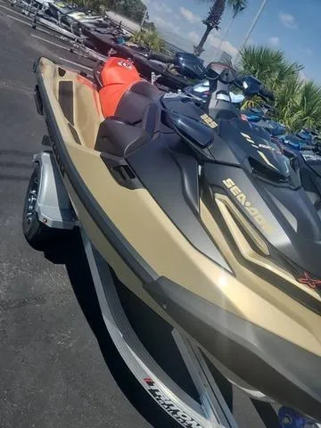 Slide: The Image of 2025 Sea-Doo Waverunner RXT-X on trailer, parked outdoors. - 8